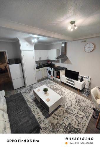 a living room with a couch and a table at Lovely 1 Bed apartment available in Croxley Green