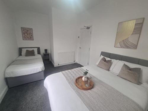 Ein Bett oder Betten in einem Zimmer der Unterkunft Cosy 3 bed House South Shields