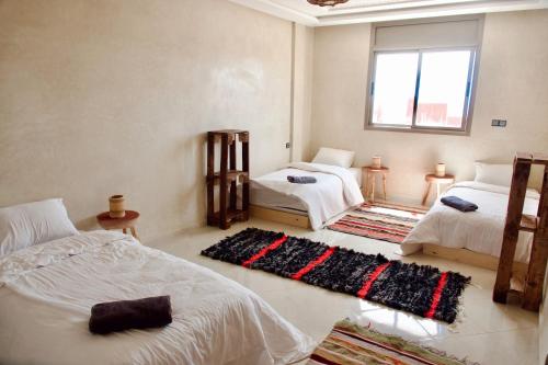 Postel nebo postele na pokoji v ubytování Cool Surfers