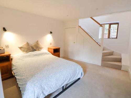 Postel nebo postele na pokoji v ubytování The Apple Store