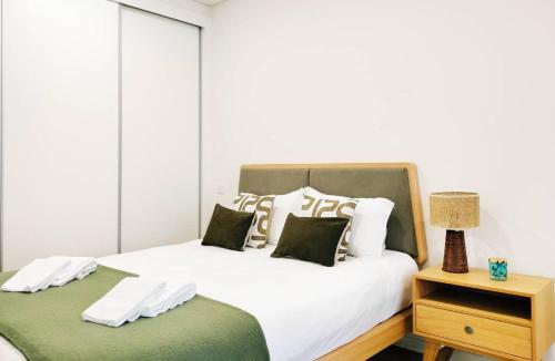 En eller flere senge i et værelse på By the Sea