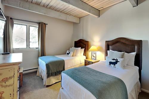 a bedroom with two beds and a window at Timberline Condominiums 3 Bedroom Standard Unit D2A in Snowmass Village