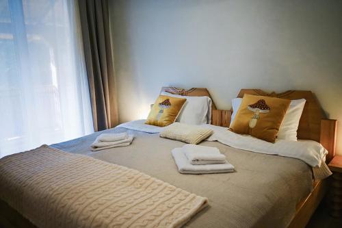 Ένα ή περισσότερα κρεβάτια σε δωμάτιο στο Rogo Chalet