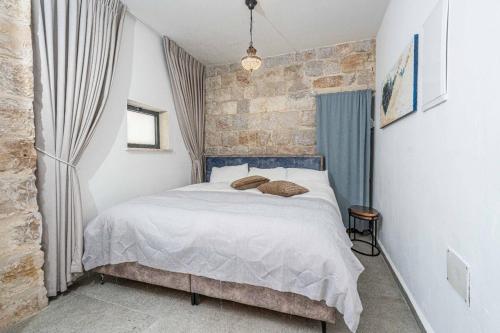 En eller flere senge i et værelse på Moses Luxury apartments 36 b