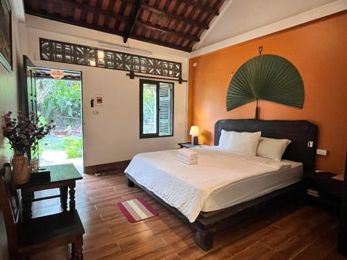 Postel nebo postele na pokoji v ubytování Tam Coc Thoms House