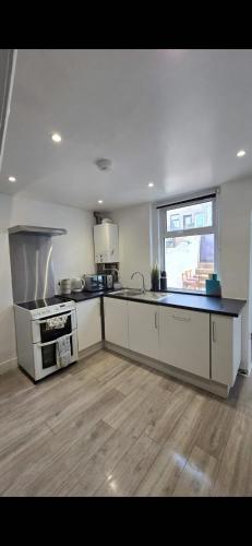 a kitchen with a stove and a counter top at Cozy Stays Lancaster in Lancaster