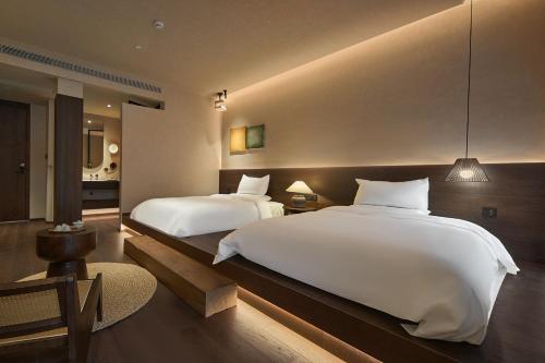 Postel nebo postele na pokoji v ubytování Chaozhou About Meisu Ancient City Store