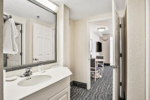 a bathroom with a sink and a mirror at Daytona Beach Resort 533- Oceanfront Oasis in Daytona Beach