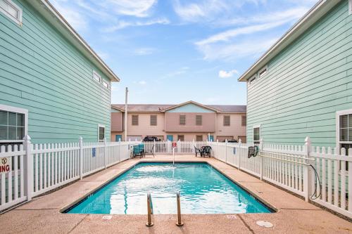 a swimming pool in the middle of a house at Family Tides Beach House in Port Aransas