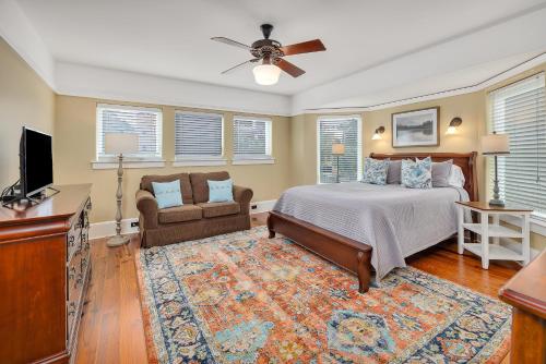 a bedroom with a bed and a flat screen tv at Shiphouse 1 - First Floor in East End