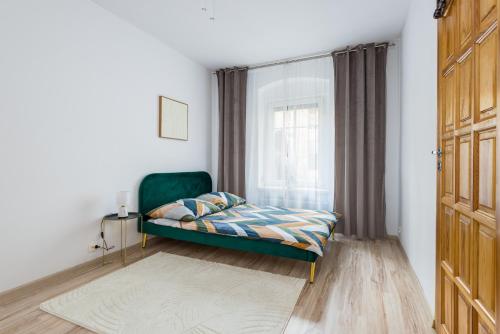Postel nebo postele na pokoji v ubytování Apartament na Grodowej koło Rynku