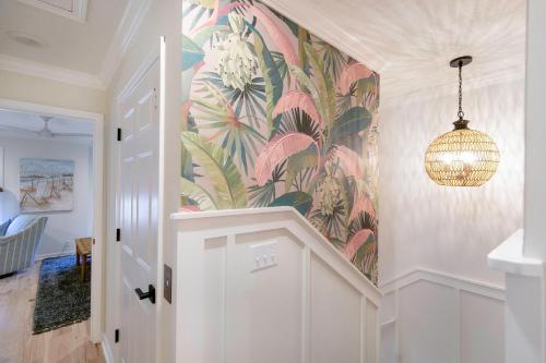 a hallway with a mural of flowers on the wall at Demere Landing #162 in Saint Simons Island