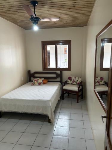 En eller flere senge i et værelse på Casa da Lúcia