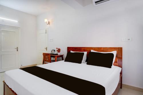 Una cama o camas en una habitación de Hotel O La Vita Oasis