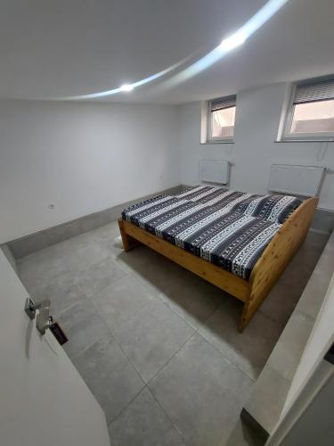 a bedroom with a bed in a white room at Ferienwohnung Tiefer Garten in Itzehoe