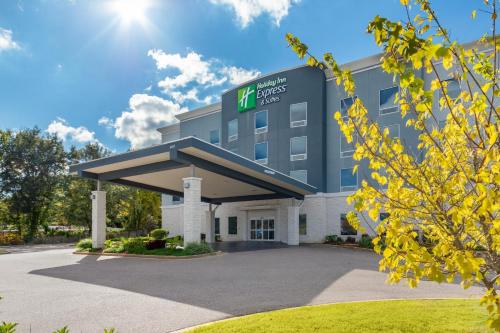 a rendering of a hotel front of a building at Holiday Inn Express & Suites Memphis Arpt Elvis Presley Blv by IHG in Memphis