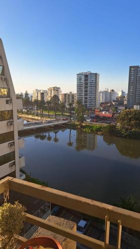 a body of water with a city in the background at Departamento de Vacasiones Viña del Mar 2026 in Viña del Mar