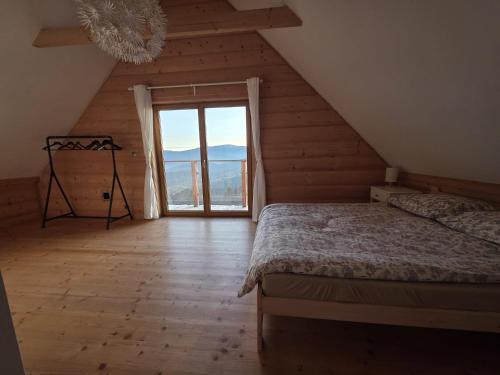 Postel nebo postele na pokoji v ubytování Blejkówka