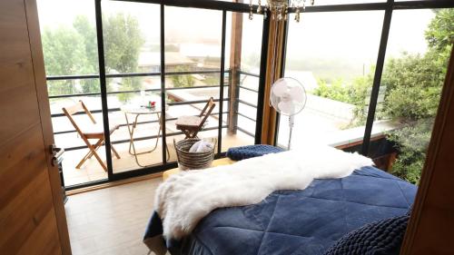 Ένα ή περισσότερα κρεβάτια σε δωμάτιο στο ElparaisodelmarQuidico