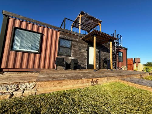 a home with a deck and a house at Unique Wine Country Stay with Deck, Firepit & Pool in Fredericksburg