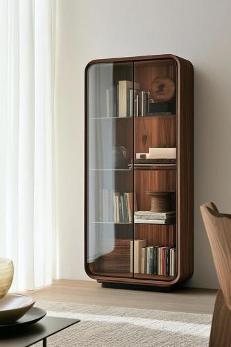 ein hölzernes Bücherregal mit Büchern in einem Wohnzimmer in der Unterkunft Ace Lagoon View Airport Hotel in Katunayaka