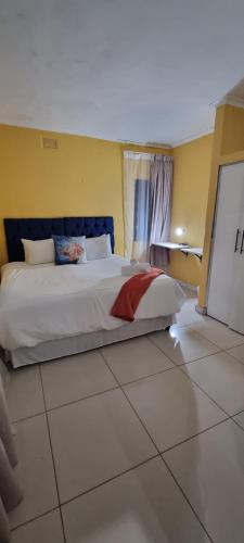 a bedroom with a large bed in a room at 56 Archer Crescent Mainhouse in Durban
