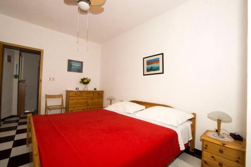 Giường trong phòng chung tại Apartmani Nata