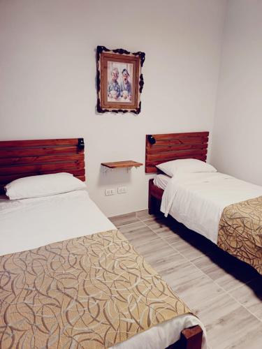 Postel nebo postele na pokoji v ubytování Hostelakis