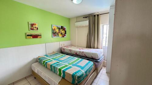 Кровать или кровати в номере Apartamentos Eldorado Thermas Park