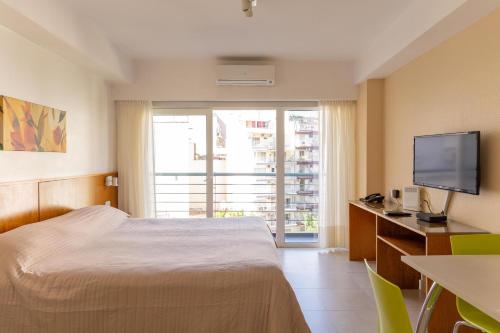 Voodi või voodid majutusasutuse Le Batiment Apartments toas