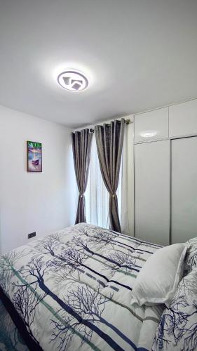 a bedroom with a bed and a window at Mimi homes in Tatu City