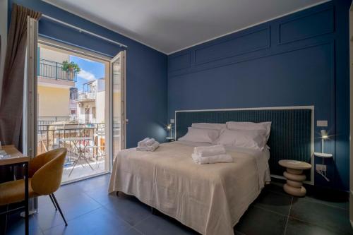 Ένα ή περισσότερα κρεβάτια σε δωμάτιο στο Dimora Fortunato