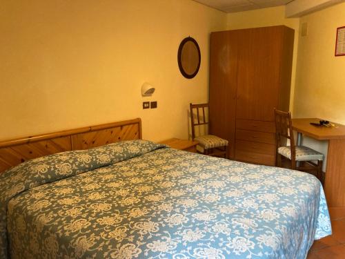 Postel nebo postele na pokoji v ubytování Hotel Regina