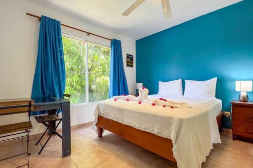 En eller flere senge i et værelse på Renaissance Residence Cabarete