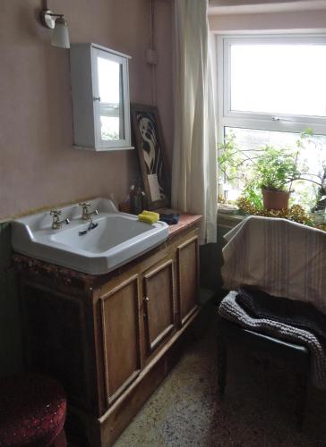 a bathroom with a sink and a window at Durrus in Durrus