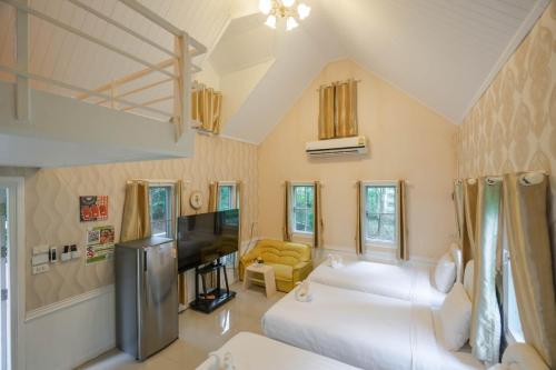 En eller flere senge i et værelse på Puprai Tarnnarm Resort