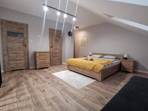 Postel nebo postele na pokoji v ubytování Apartamenty Ewa