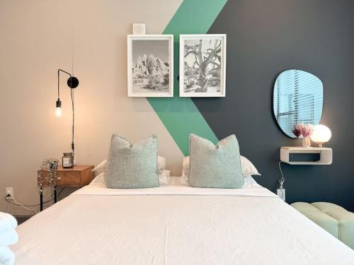 a bedroom with a large bed with blue and green walls at D Cityscape Getaway Fort Worth SameDay Booking in Fort Worth