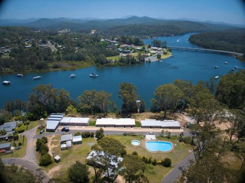 an aerial view of a lake with boats in the water at Sunlit Waters at Batemans in Nelligen
