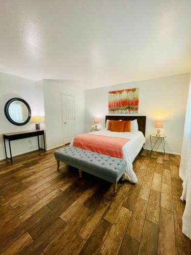 a bedroom with a bed and a bench in it at Tempe Escape with Heated Pool, Billiards & Firepit Fun in Tempe