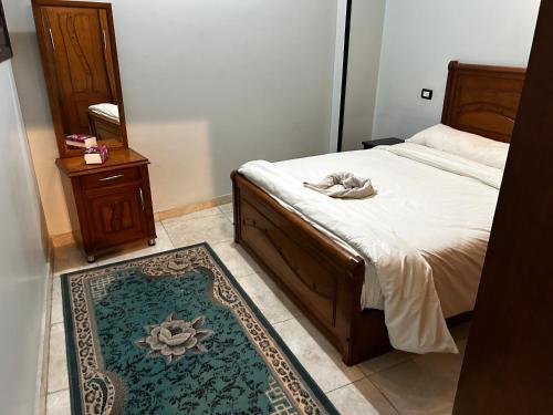 Een bed of bedden in een kamer bij Queen of the Nile