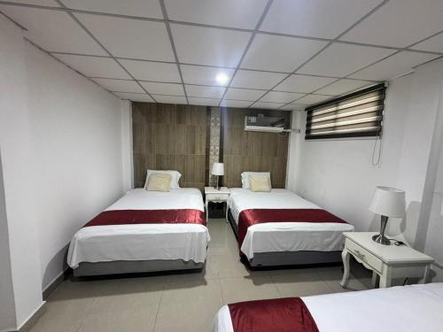 Cama o camas de una habitación en The Royalty Lite