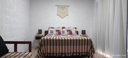 Ένα ή περισσότερα κρεβάτια σε δωμάτιο στο Micasa