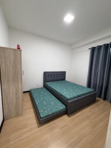 Postel nebo postele na pokoji v ubytování JJJ Homestay-SK One Garden City Residence