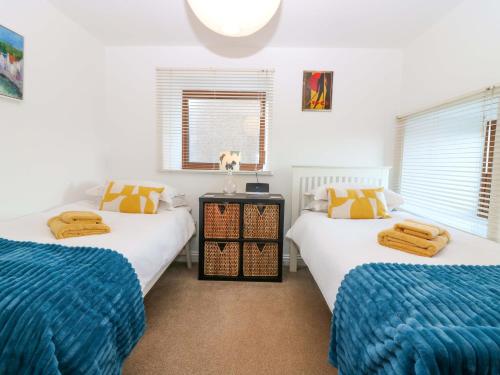 En eller flere senge i et værelse på Bridle Cottage