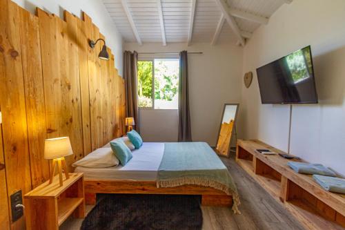 Giường trong phòng chung tại Villa Datura