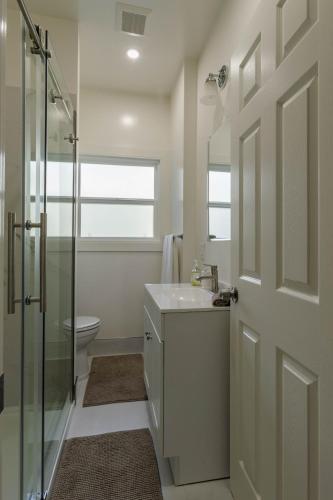a bathroom with a shower and a sink and a toilet at 1 Berkeley - Entire Apartment - Private, Spacious in Berkeley