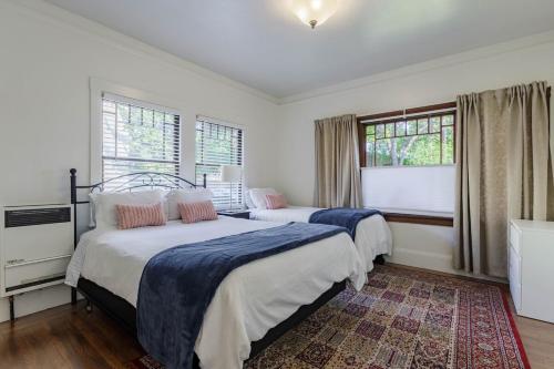 a bedroom with two beds and a window at 1 Berkeley - Entire Apartment - Private, Spacious in Berkeley