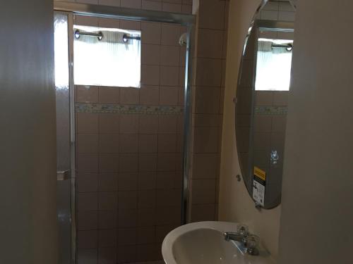 a bathroom with a sink and a shower at Catalina Island Seacrest Inn in Avalon