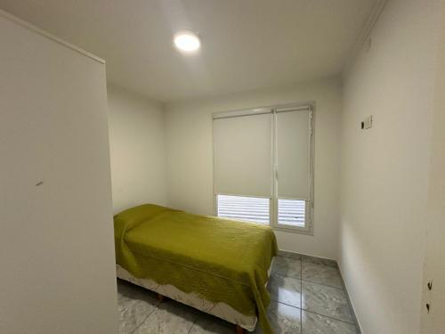 Giường trong phòng chung tại Colinas de Peralta Ramos